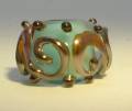 Encased Turquoise Bead with Lustre Glass Scrolls
