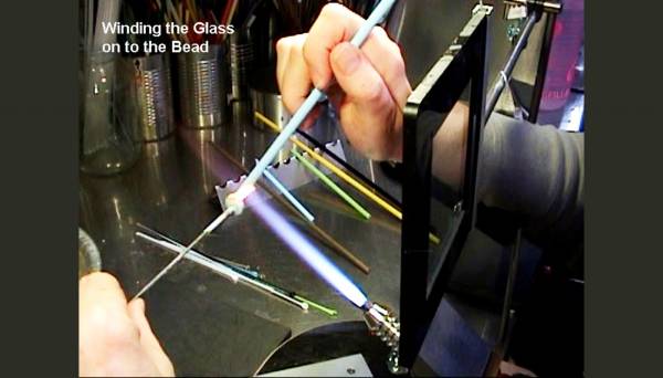 Continuing to wind the glass onto the mandrel